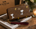 COACH x Peanuts Snoopy Zip Around Wallet – Brown Signature Canvas